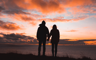 Man and woman watching the sunrise